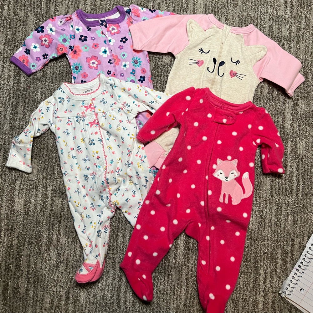 Mixed brand of preemie sleep and play outfits.